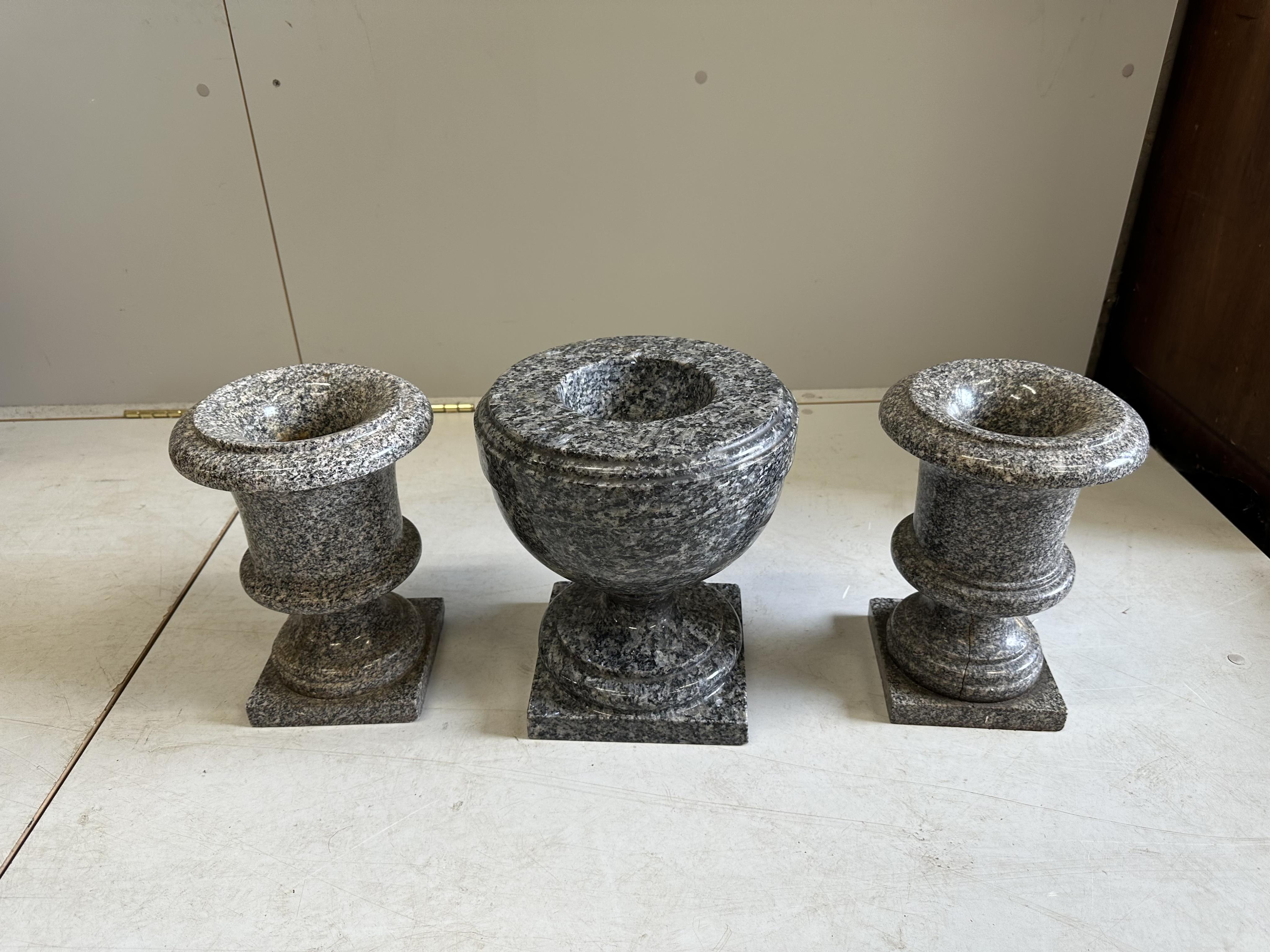 Three (two plus one) reconstituted marble urns, largest diameter 26cm, height 29cm. Condition - fair-good